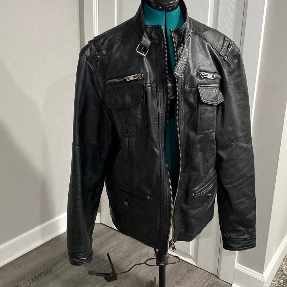 Black leather jacket. Fits like a Large, but tag size is cl